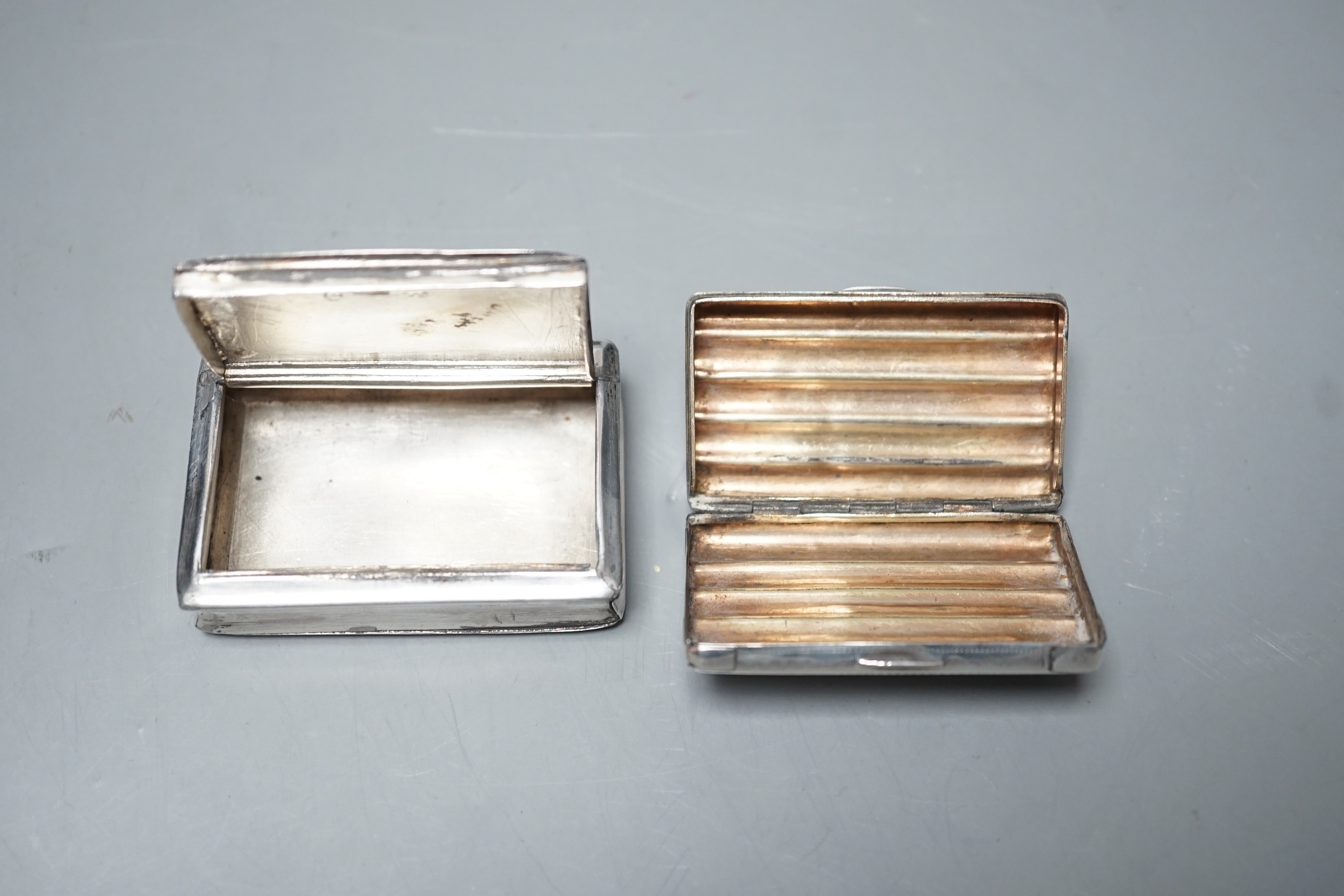 A George IV engine turned silver rectangular snuff box, Lawrence & Co, Birmingham, 1824, 59mm and an earlier ribbed silver snuff box by Thropp & Taylor, Birmingham, 1811, both a.f.